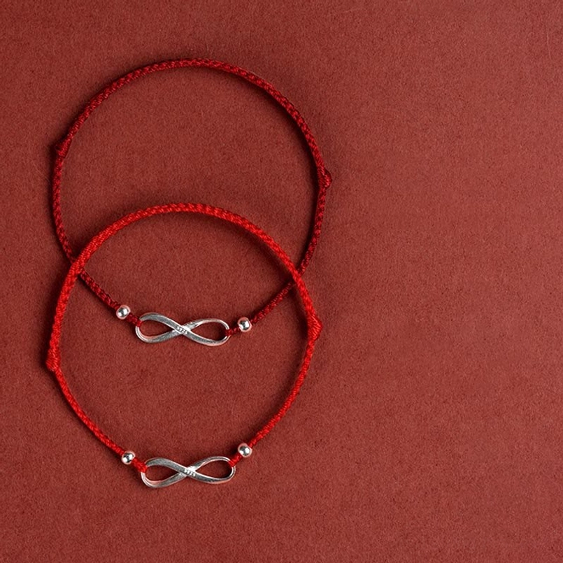 Red string endless knot bracelet ancient Buddhist tradition symbol