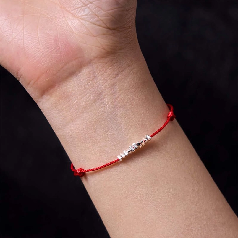 Delicate red string bracelet fate connection symbol jewelry piece