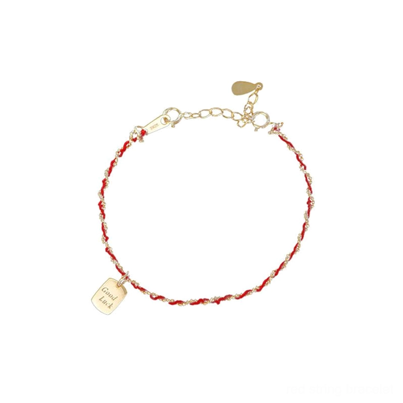 Complete red string good luck bracelet circular display with full adjustable chain on black background