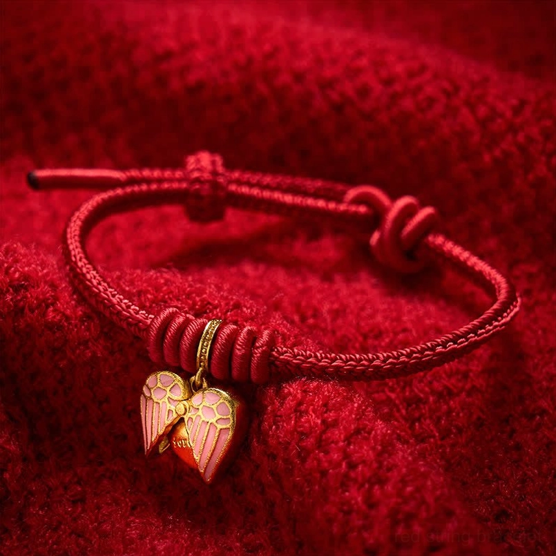 Adjustable red string bracelet featuring half-open heart pendant with gold decorative ring