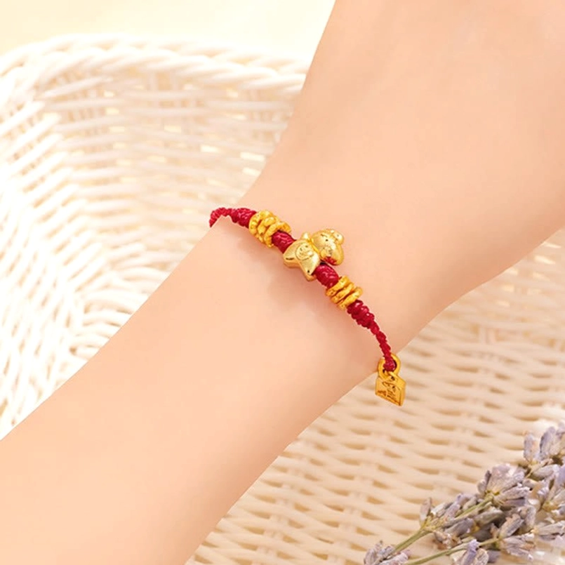 Close up view of red string horse bracelet worn on wrist