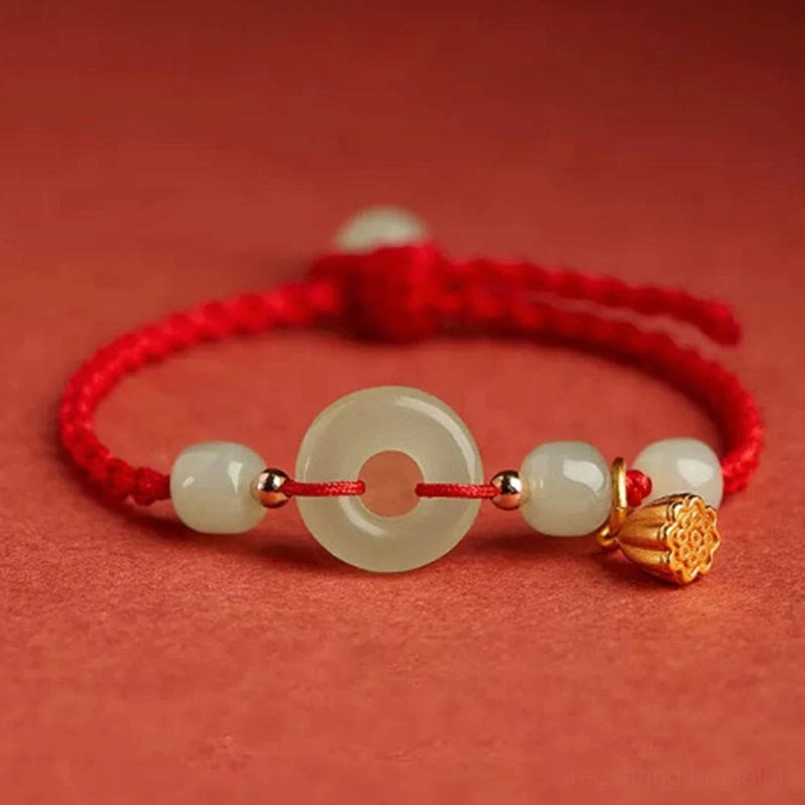 Adjustable red string jade bracelet with woven knot and lotus pendant