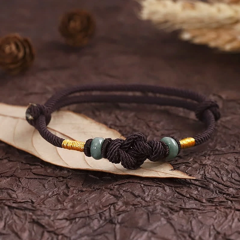 Red string jade bracelet handmade with natural materials and authentic jade