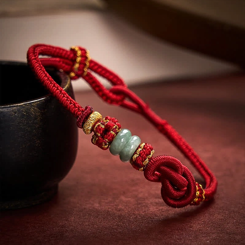 Large knot jade bracelet with decorative golden wrap side angle
