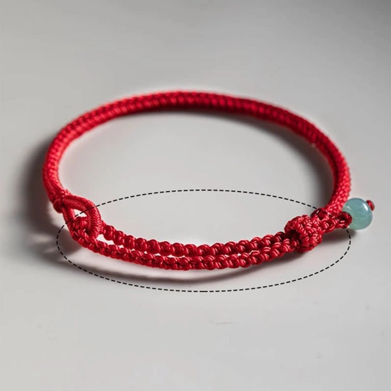 Red string jade bracelet size guide flat lay showing adjustable knots