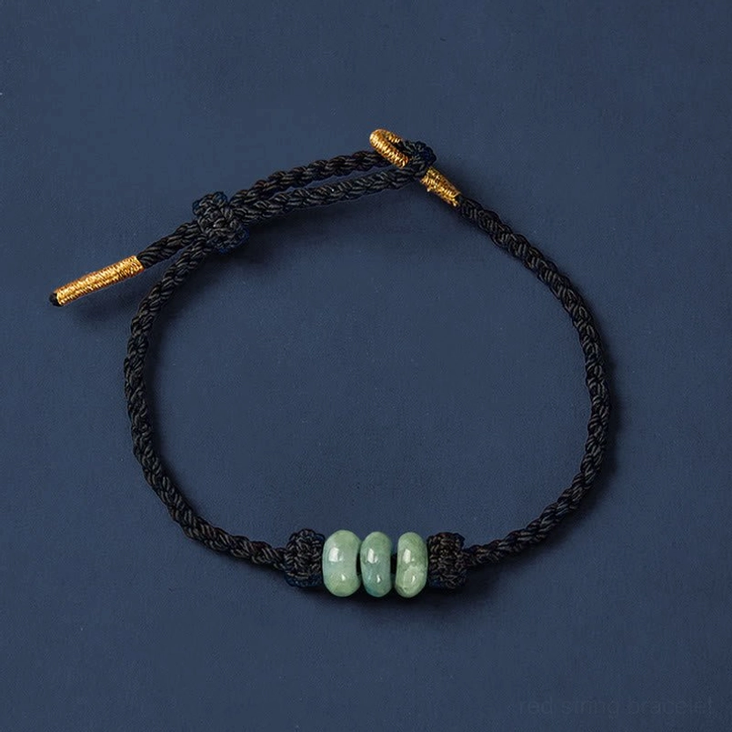 Red string jade protection bracelet showing fate destiny spiritual meaning