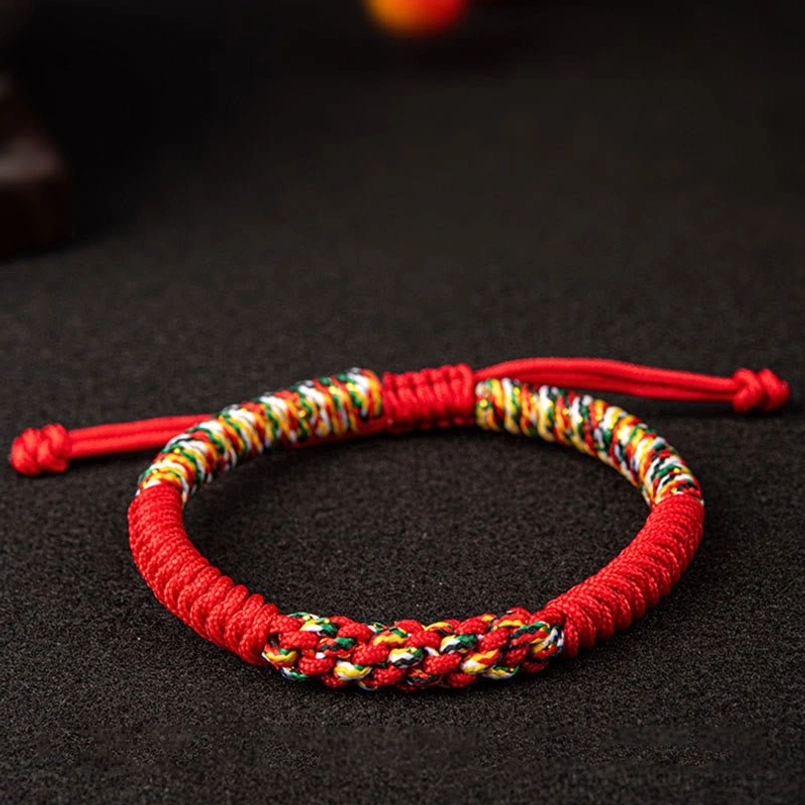 Red string King Kong Knot luck bracelet front view with adjustable ties and multicolor threading