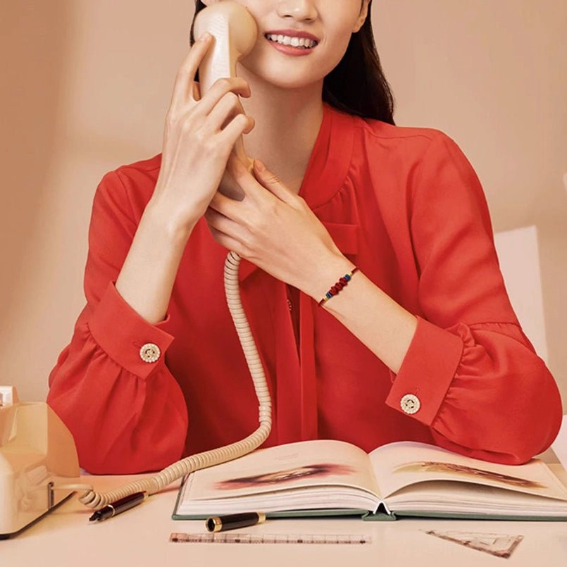 Red string prosperity bracelet office outfit styling professional look