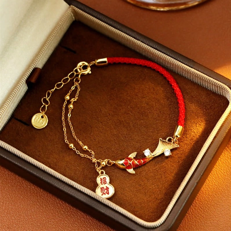 Red string koi wealth bracelet with double-layered gold chain and zhao-cai prosperity tag