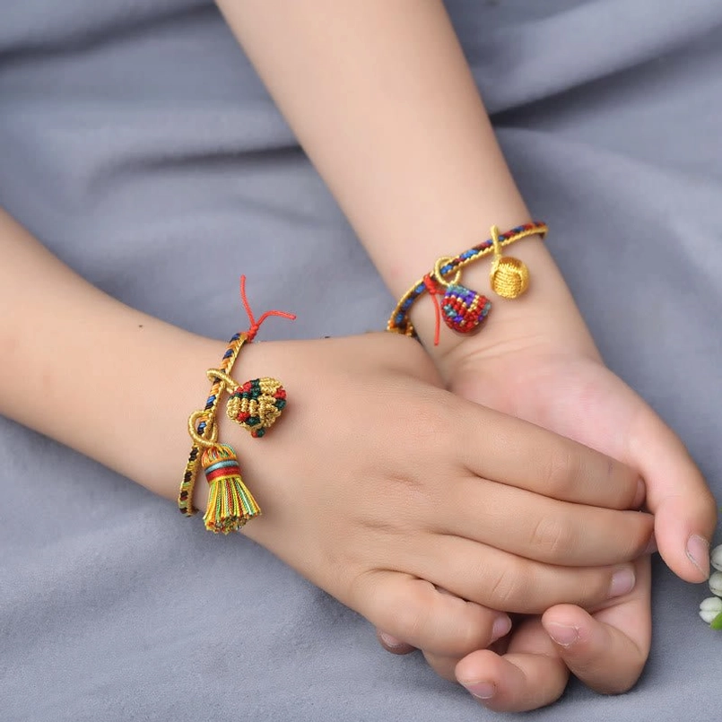 Red string lucky bracelet with five element colors and golden ball charm pendant