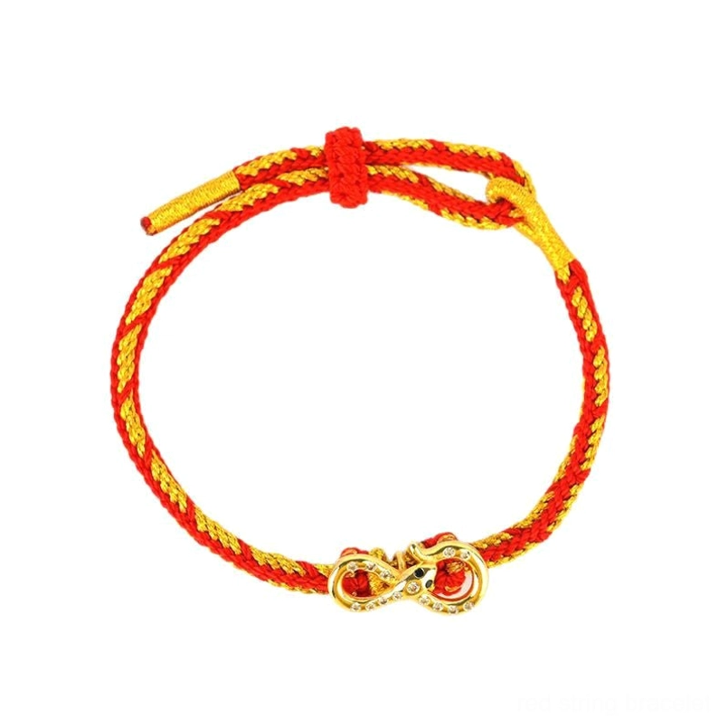 Red String Mobius Snake lucky bracelet flat lay showing two-tone twisted rope with central infinity charm and toggle knot