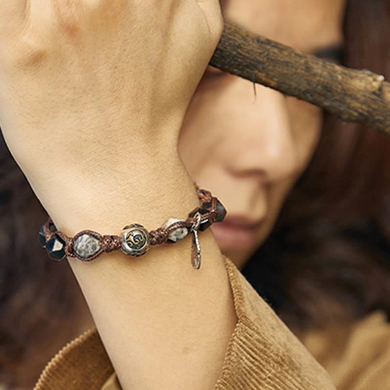 gift packaging view of 925 silver feather red string obsidian bracelet