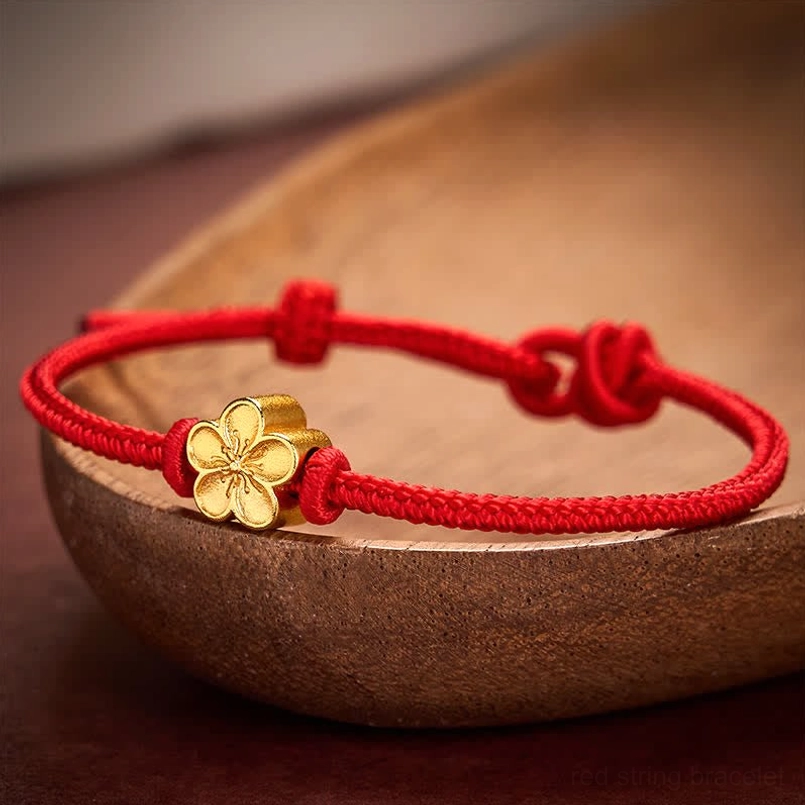 Premium handwoven red cord bracelet with 3D gold flower charm and slide knot