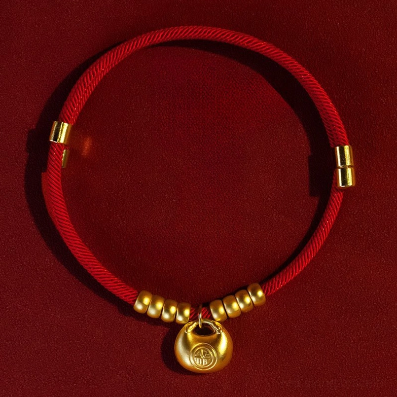 Adjustable red pet collar overhead view showing gold sliding clasp and bead details