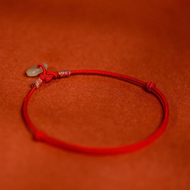 Red string pet collar with colored woven knots, jade pendant and adjustable sliding closure