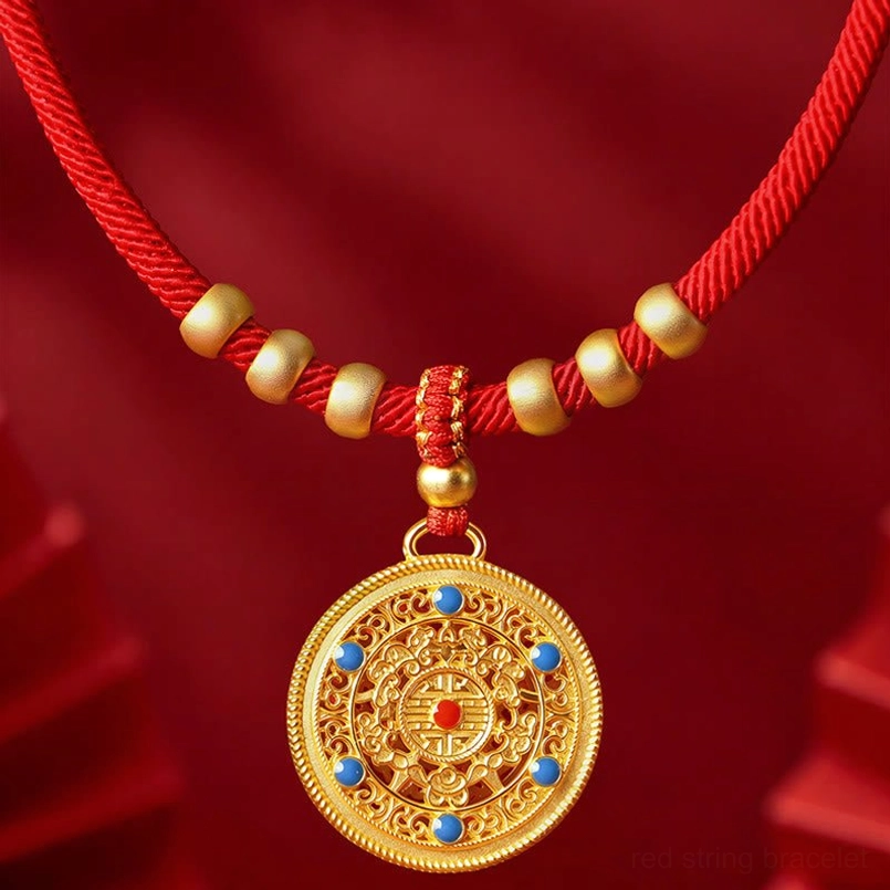 Red woven pet collar with large ornate gold compass pendant and decorative beads