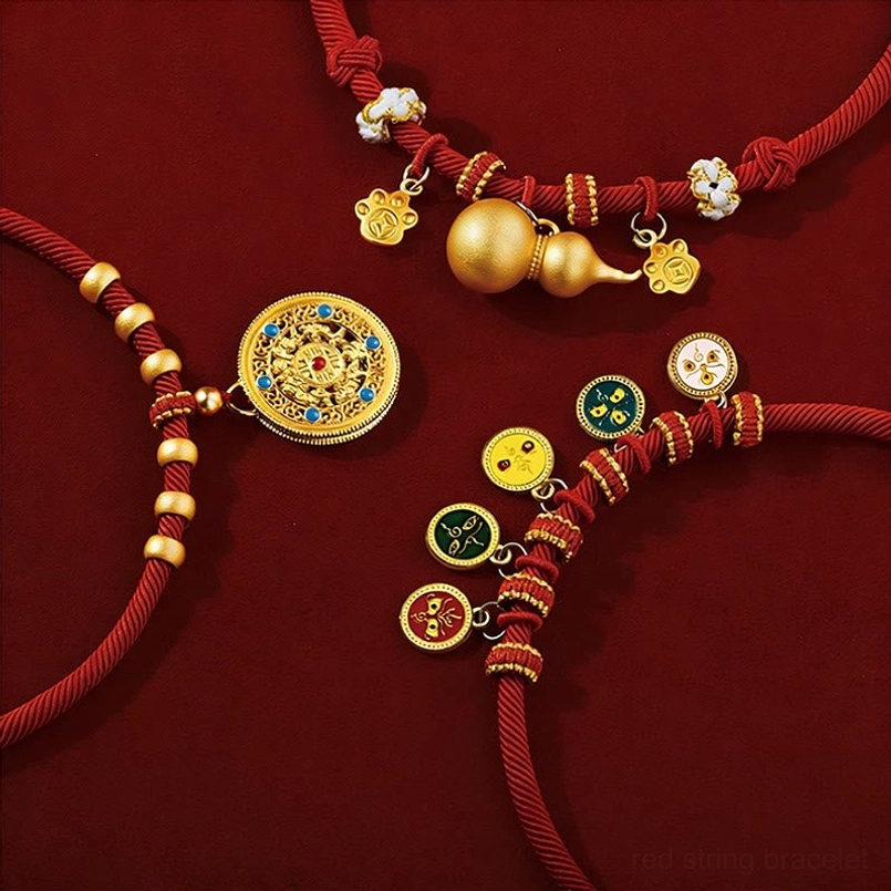 Red string pet collar with five directions gods of wealth charm pendant close-up