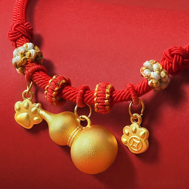 Red string pet collar with woven floral decorative beads and gold gourd paw charms