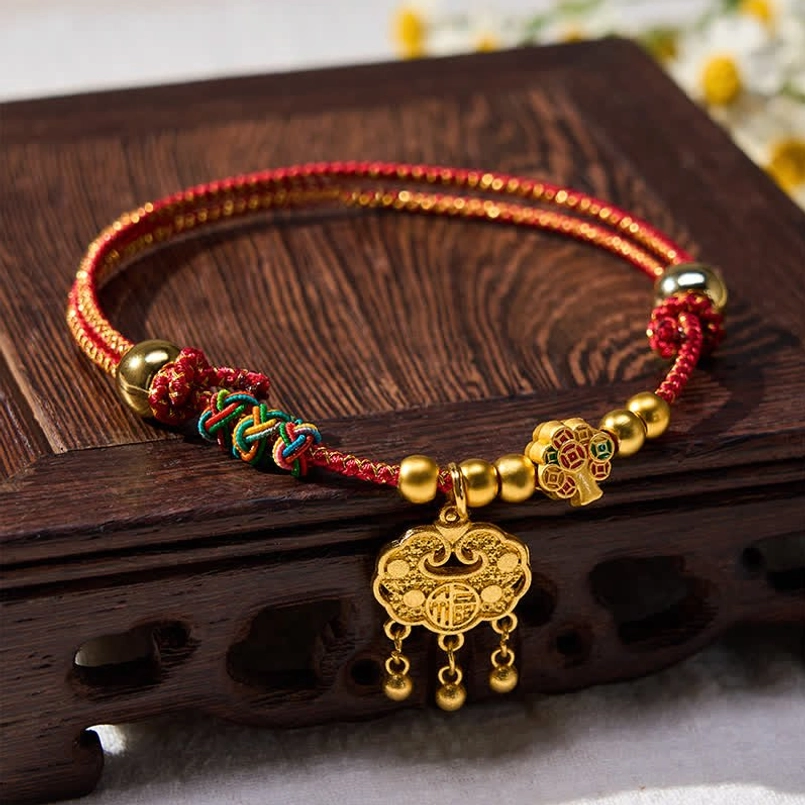 Handmade red braided pet collar with fu character and gold beads, top-down flat lay