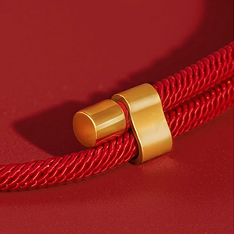 Decorative red woven pet collar with intricate gold prosperity charm and beaded details