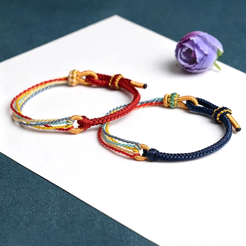 Red and deep blue handmade five color protection bracelets side by side