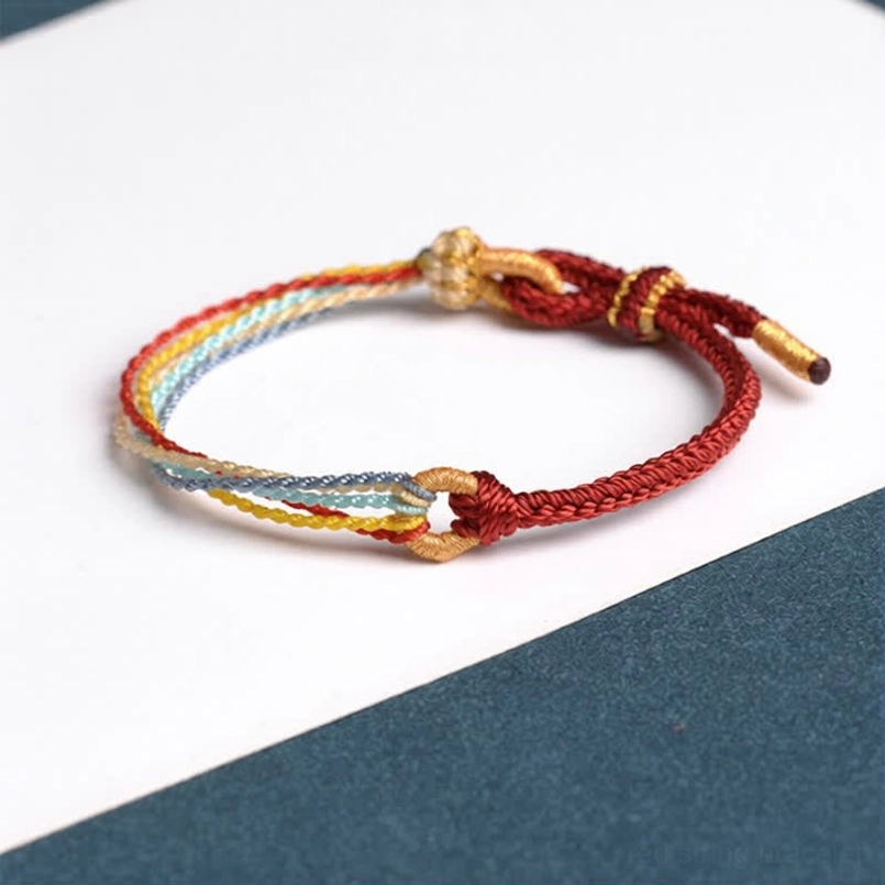 Red handmade five color protection bracelet with adjustable gold knot closure