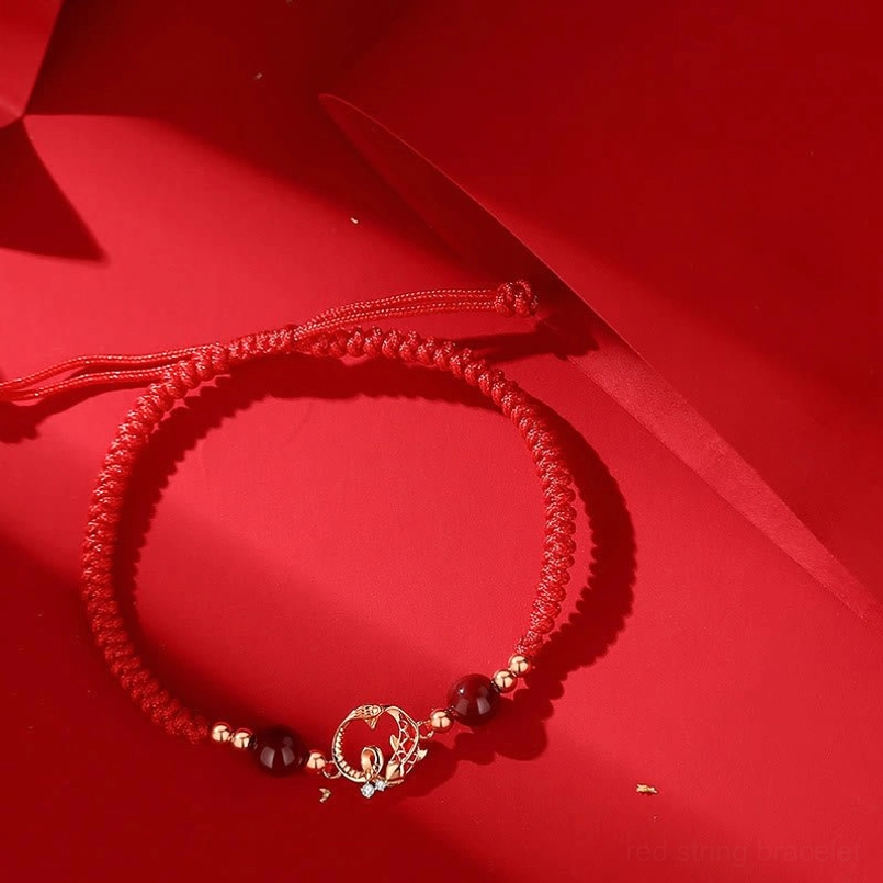 925 sterling silver snake koi fish charm bracelet with red braided cord and cinnabar beads side view