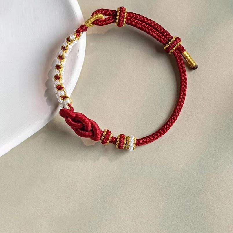 Red string protection bracelet with true love knot symbol for luck, fate and spiritual connection