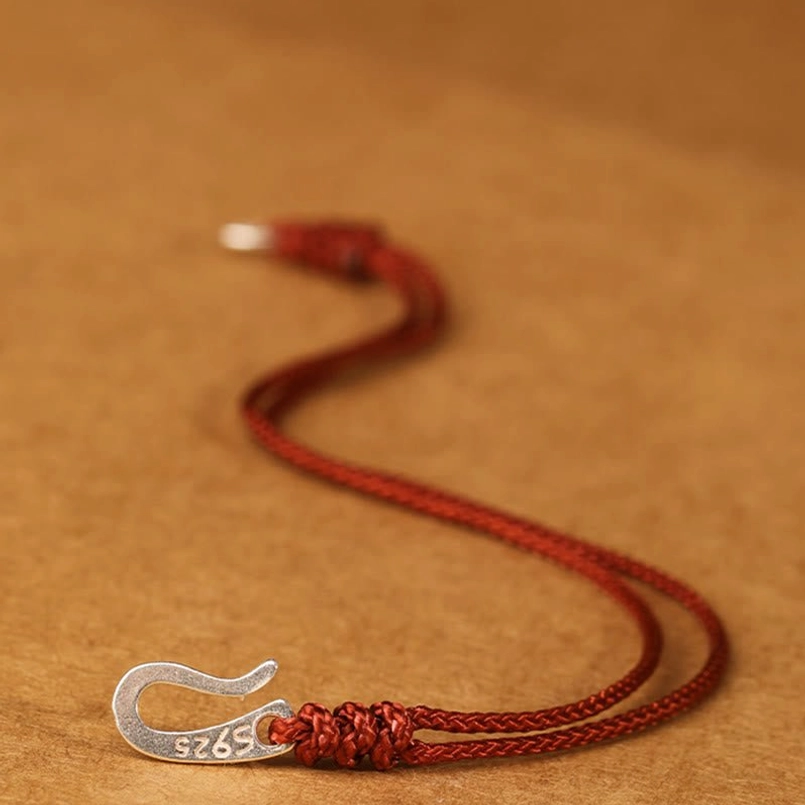 Red string protection bracelet with 925 silver components top view