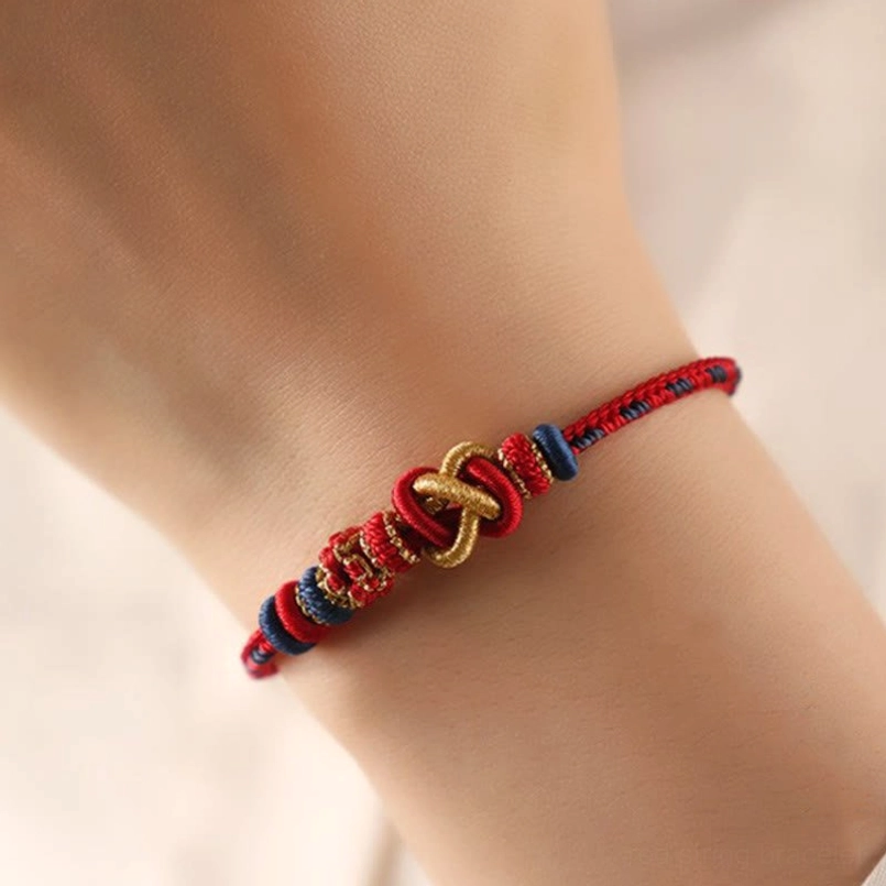 On Model Wrist Wear View Of Multicolor Red String Protection Bracelet