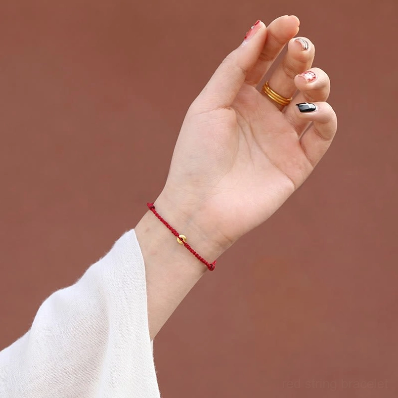 protection red string bracelet worn on wrist showing slim elegant style