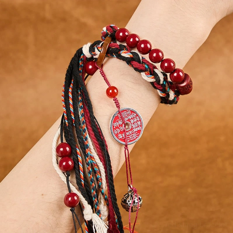 Cinnabar red string protection bracelet worn on human wrist side view
