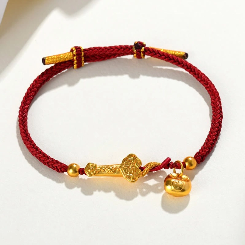 Red string bracelet featuring Ruyi scepter charm, golden bell and polished accents
