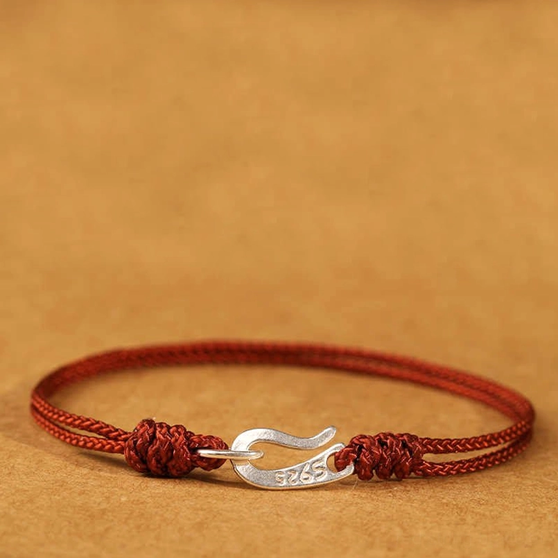Handmade 925 sterling silver red string bracelet braided cord texture detail
