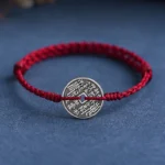 Red braided sterling silver coin protection bracelet with ancient square-hole coin detail