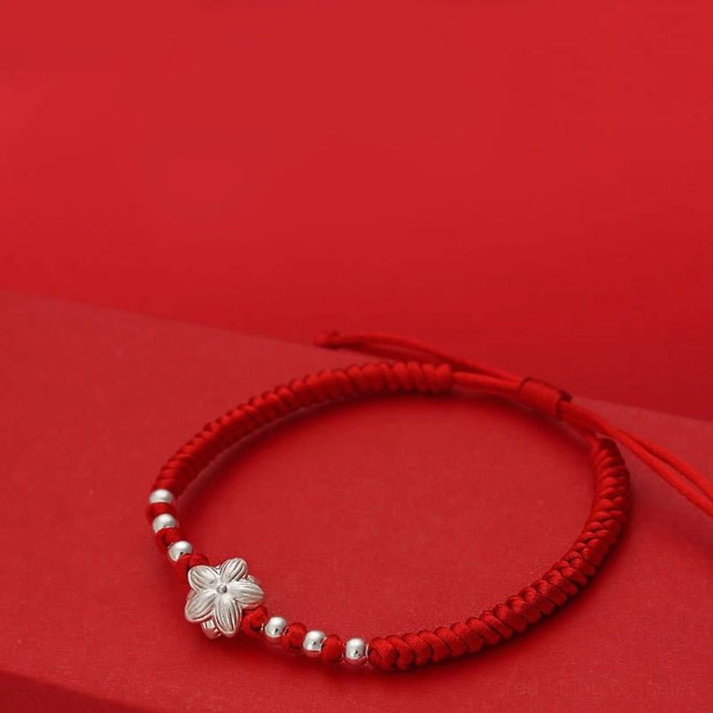 Red string silver lotus bracelet right side view small polished silver beads