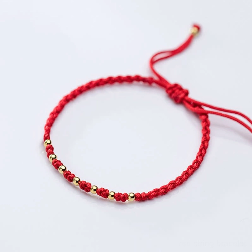 Red braided string bracelet with gold accents spiritual protection talisman