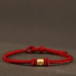 Red string Tibetan 999 gold Om Mani Padme Hum luck protection bracelet front view