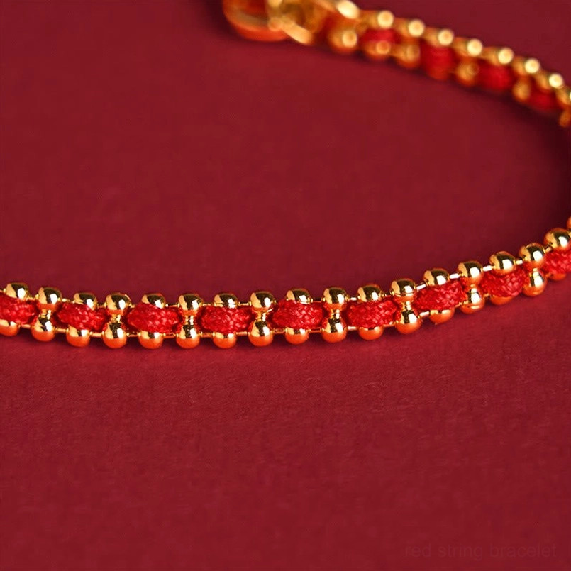 Red woven cord alternating with gold round beads showing bracelet weave pattern