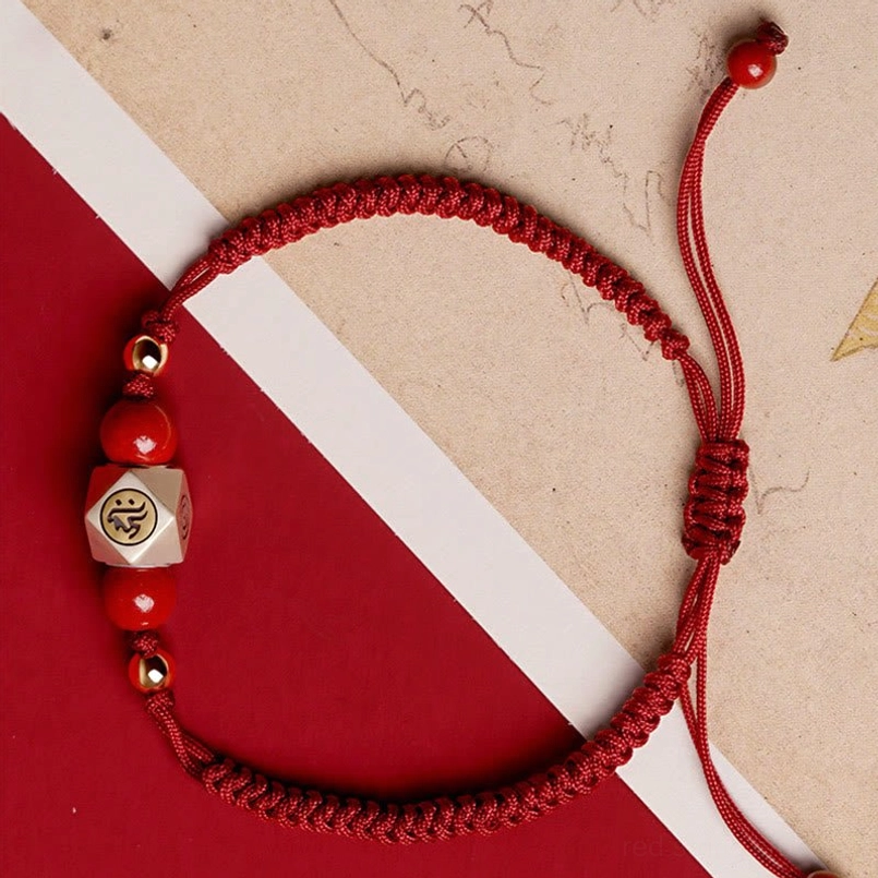 Red braided protective bracelet with cinnabar beads and adjustable pull tie closure