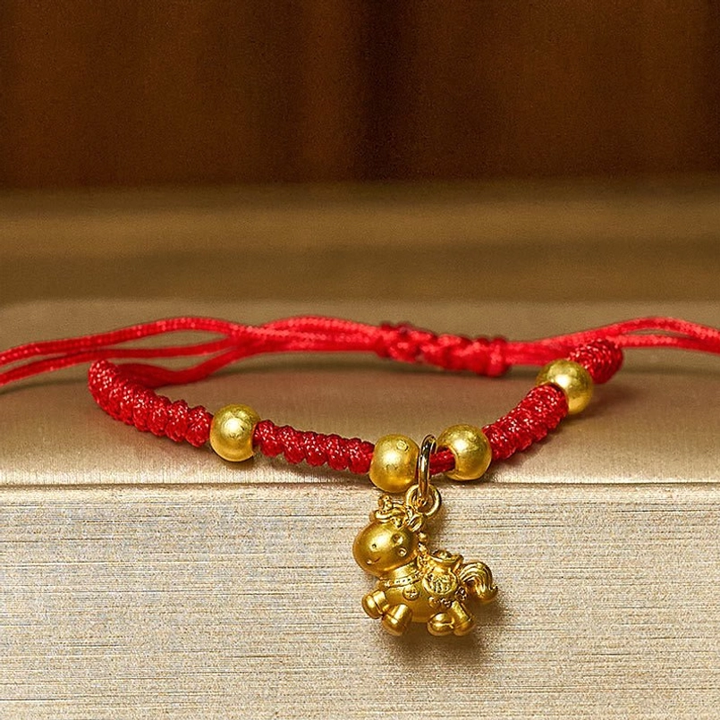 Handcrafted red braided horse bracelet with detailed 3D horse pendant and gold accent beads