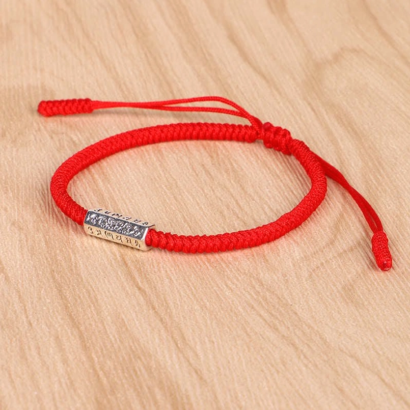 Braided red cord Om Mani Padme Hum luck bracelet with engraved silver bead and pull knot