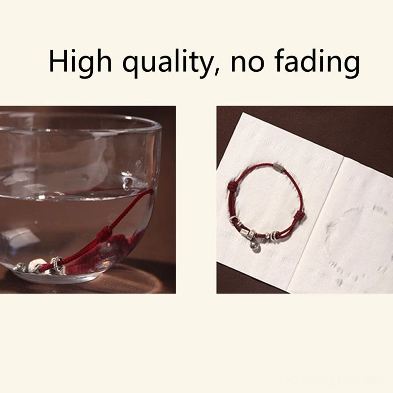 Red string wealth bracelet worn with casual lifestyle outfit styling