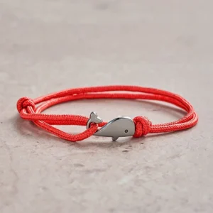 Red double wrap braided whale charm bracelet with silver metal clasp - front view