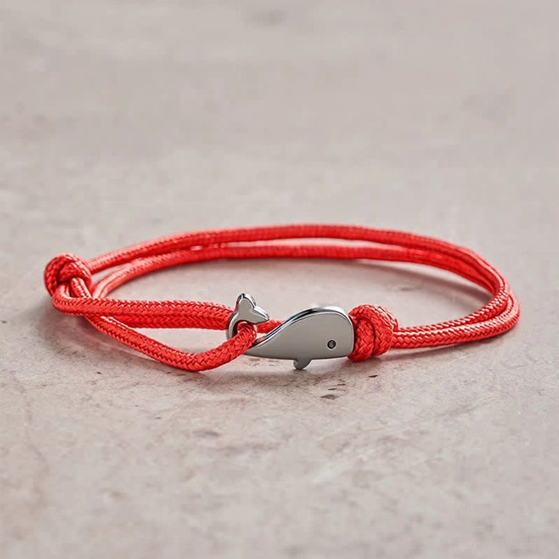 Red double wrap braided whale charm bracelet with silver metal clasp - front view