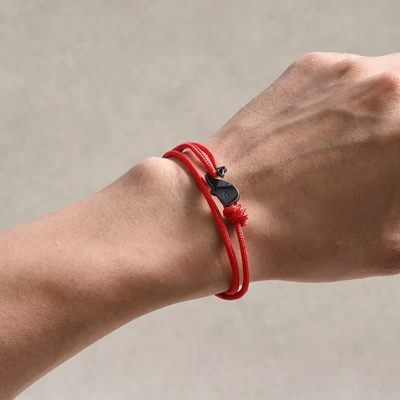 Red whale connection bracelet worn on wrist - real life wear demonstration