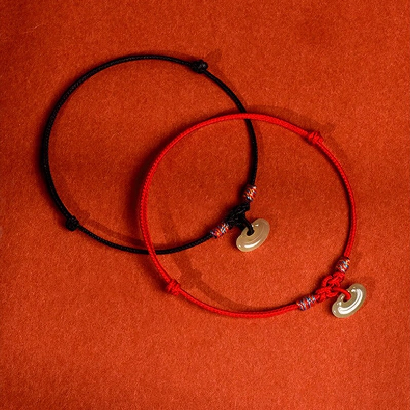 Red woven pet collar with adjustable jade pendant, protective spiritual design