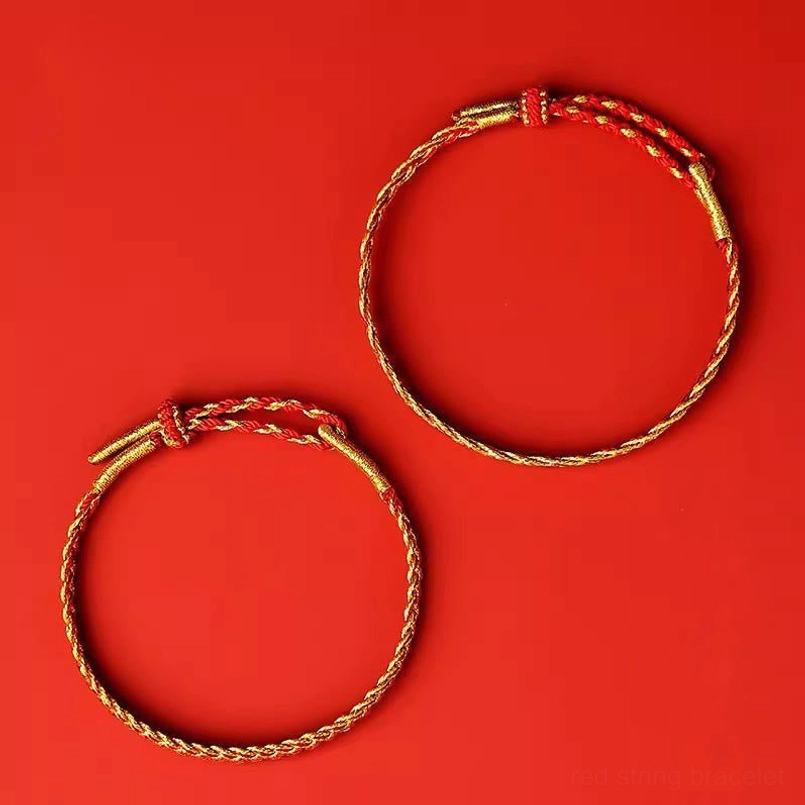Two red and yellow string bracelets showing adjustable knot closure and woven texture detail