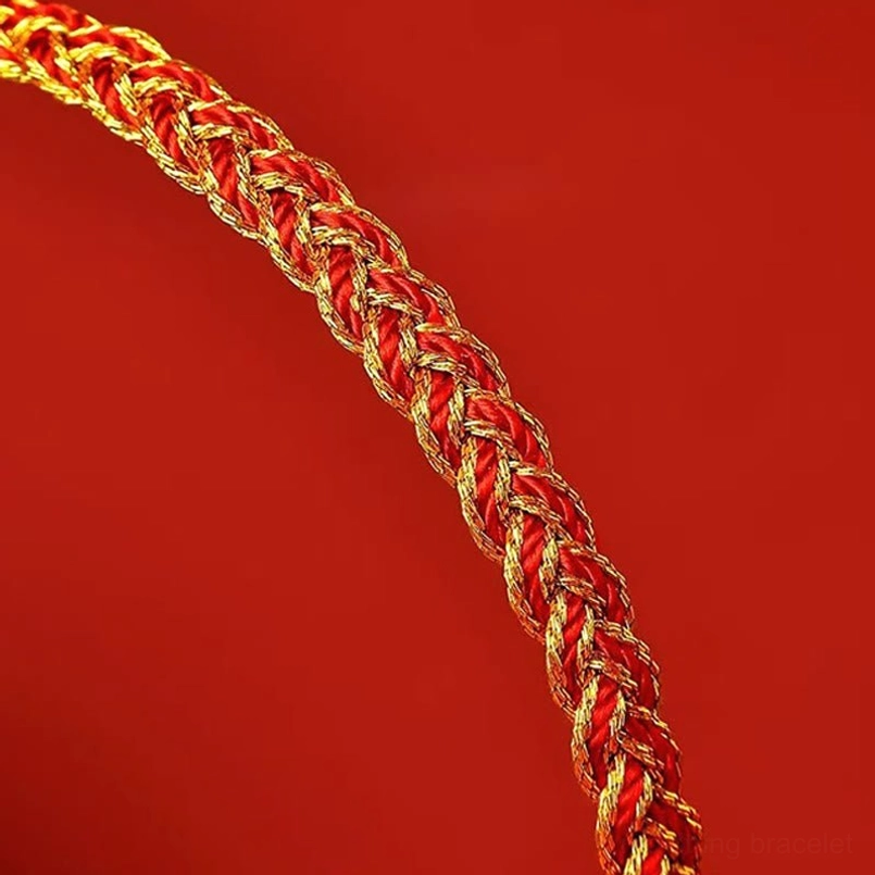 Red and yellow string prosperity bracelet showing natural fiber quality and handmade craftsmanship details