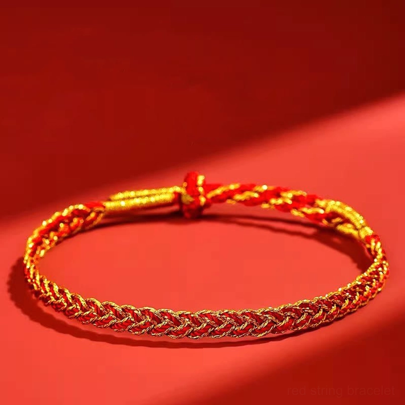 Close-up side view of red and yellow braided luck bracelet showing intricate weave pattern and knot